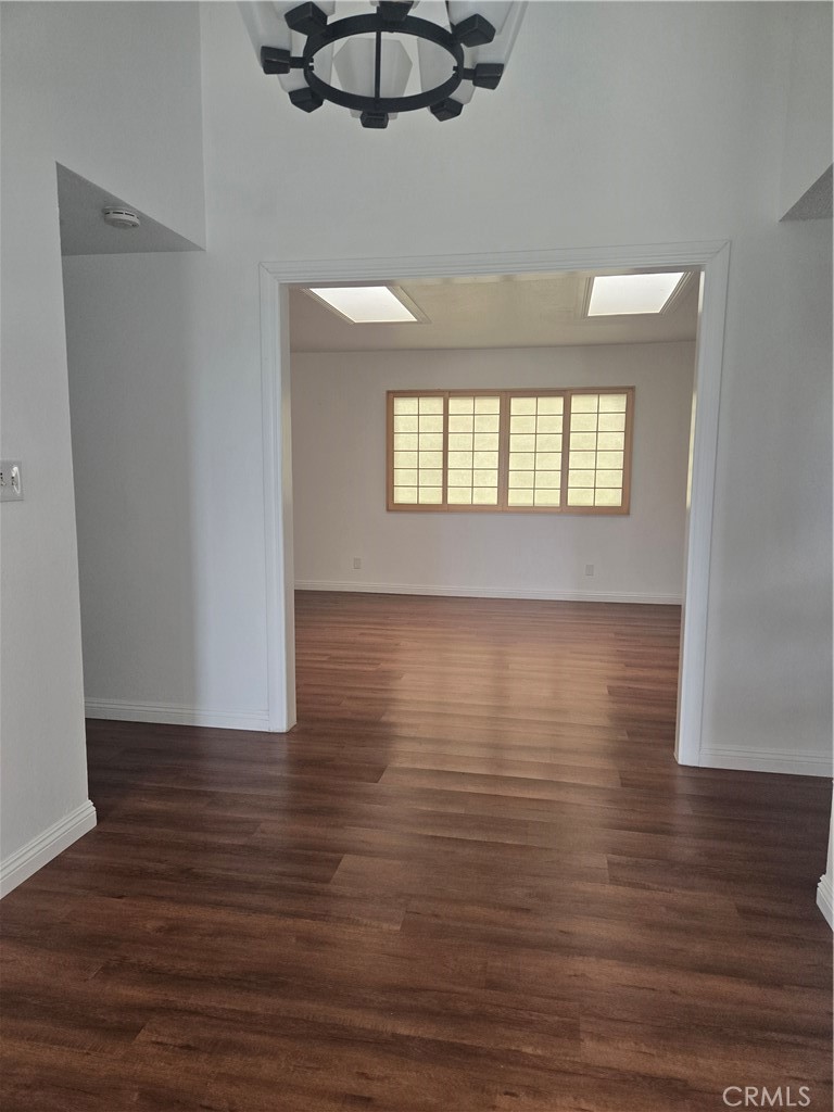 9388 Valley View Street Rancho Cucamonga, CA 91737 - Photo 6 of 40 a view of room with window and wooden floor