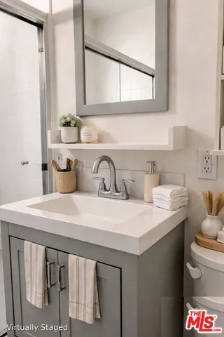 a kitchen with a sink a stove and a microwave