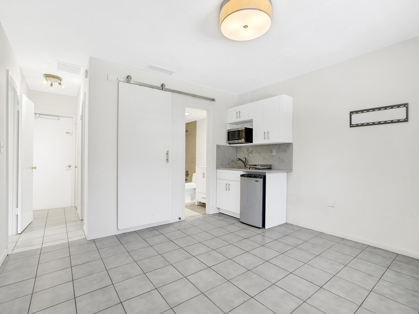 1129 Pebble Beach Lane, Unit 11 Marathon, FL 33050 - Photo 15 of 36 a kitchen with cabinets and steel appliances