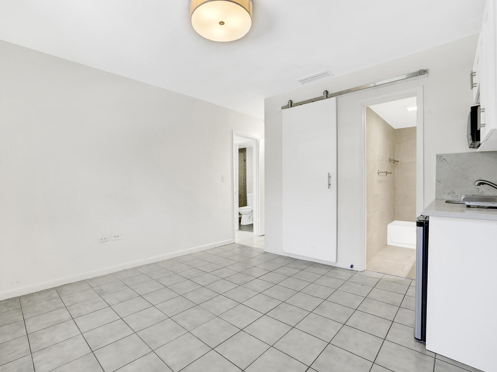 1129 Pebble Beach Lane, Unit 11 Marathon, FL 33050 - Photo 16 of 36 a view of a room with wooden floor