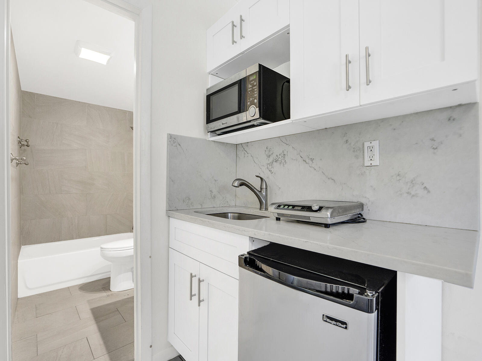 1129 Pebble Beach Lane, Unit 11 Marathon, FL 33050 - Photo 17 of 36 a kitchen with a sink and a stove top oven