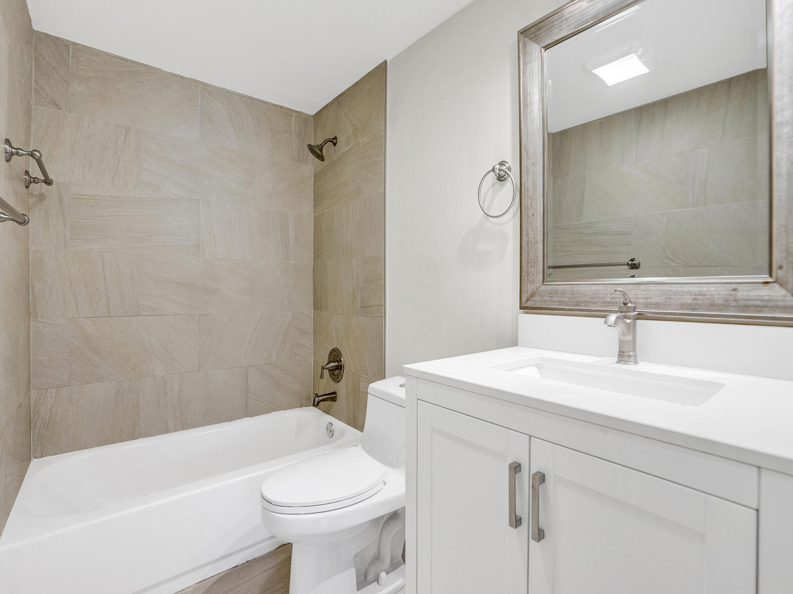 1129 Pebble Beach Lane, Unit 11 Marathon, FL 33050 - Photo 18 of 36 a bathroom with a sink a toilet and a bathtub