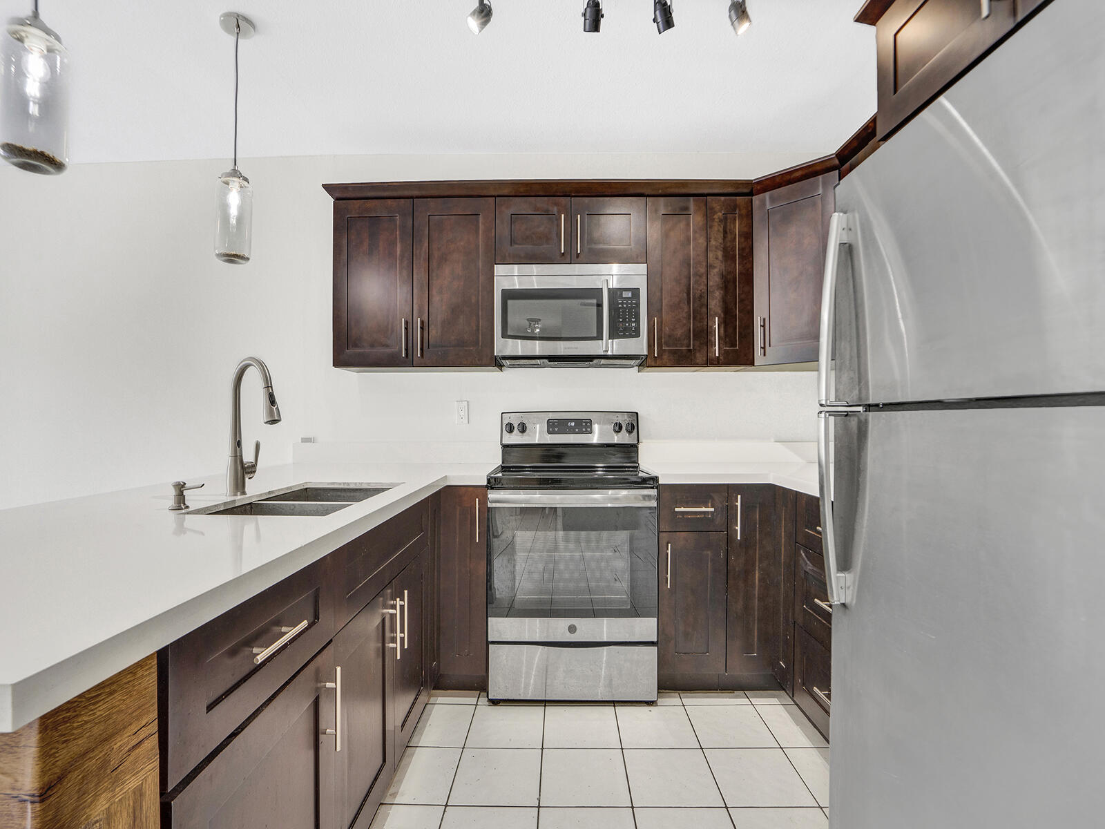 1129 Pebble Beach Lane, Unit 11 Marathon, FL 33050 - Photo 2 of 36 a kitchen with a sink and a stove top oven
