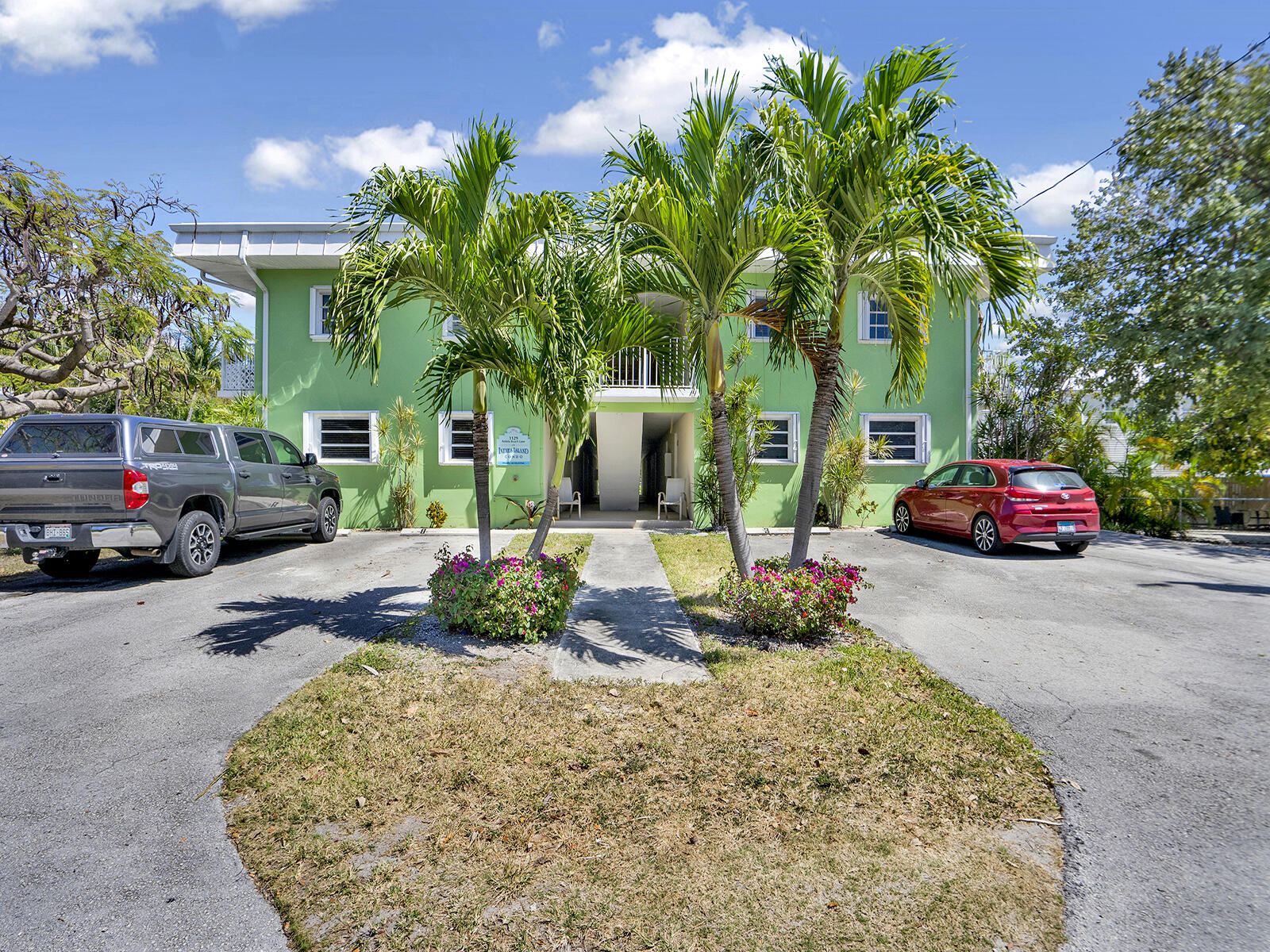 1129 Pebble Beach Lane, Unit 11 Marathon, FL 33050 - Photo 24 of 36 a cars parked in front of a house