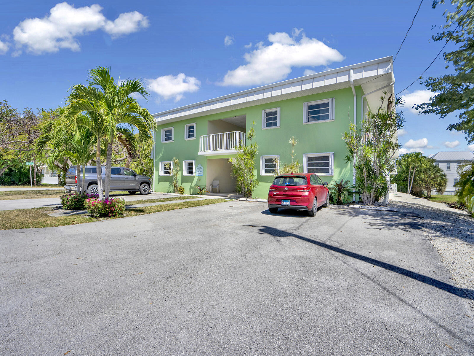 1129 Pebble Beach Lane, Unit 11 Marathon, FL 33050 - Photo 25 of 36 a car parked in front of a house