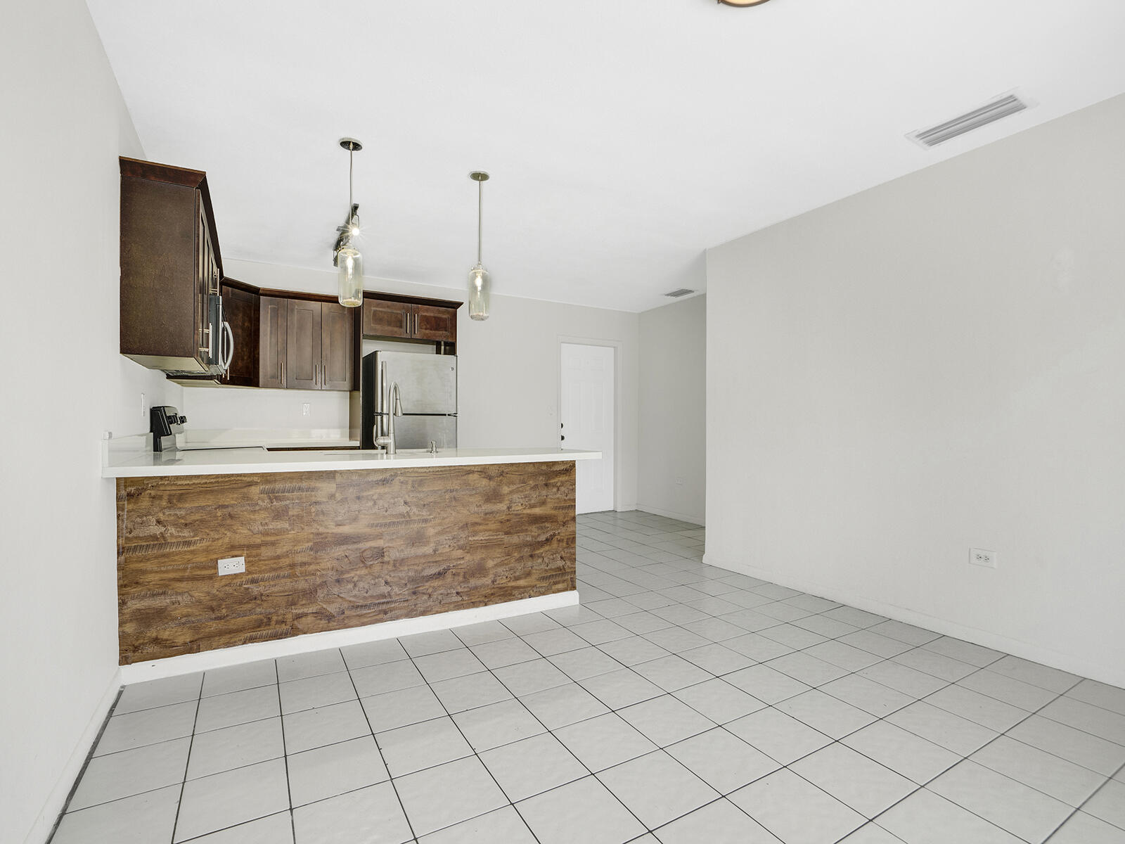 1129 Pebble Beach Lane, Unit 11 Marathon, FL 33050 - Photo 7 of 36 a view of living room with granite countertop furniture and fireplace