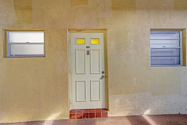 a view of front door with wooden floor