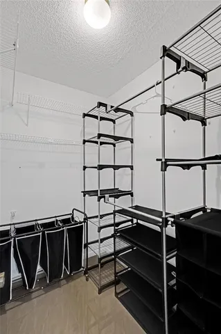 a view of a balcony with floor to ceiling windows with wooden floor