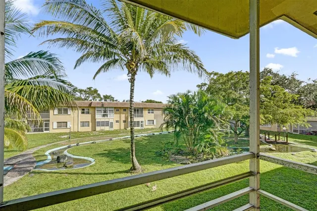 a kitchen with cabinets and white appliances