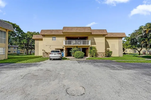 a garden with trees in front of it