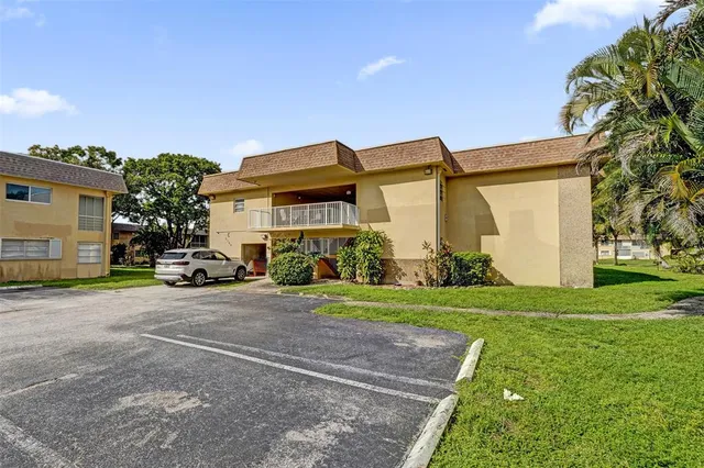 a view of a park with large trees