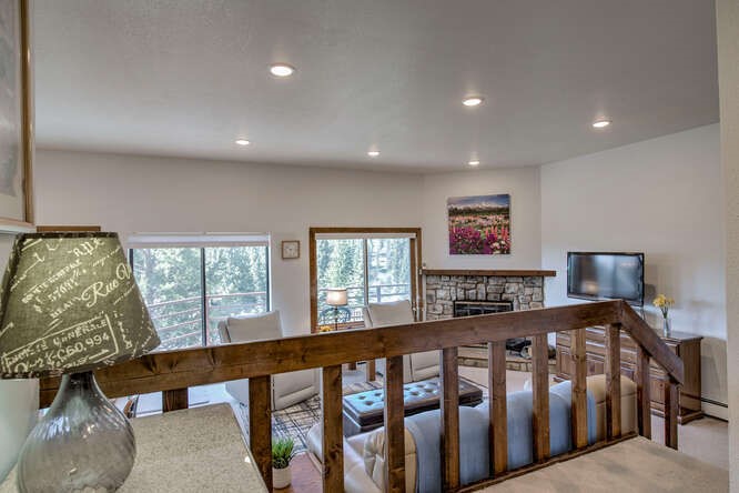 98000 Ryan Gulch Road, Unit E104 Silverthorne, CO 80498 - Photo 11 of 34 a bedroom with furniture and a window