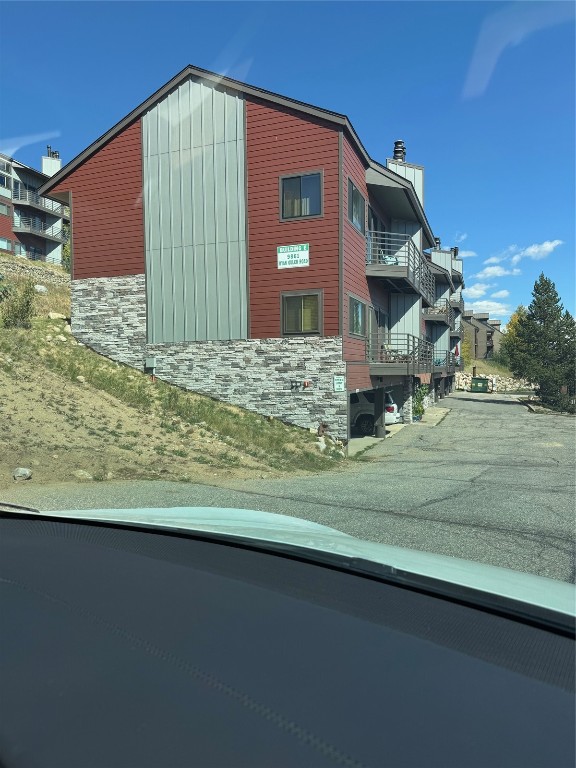 98000 Ryan Gulch Road, Unit E104 Silverthorne, CO 80498 - Photo 24 of 34 a view of a house with a yard