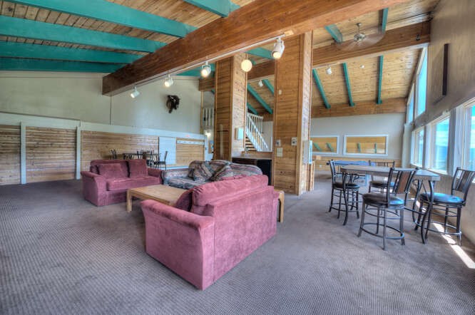 98000 Ryan Gulch Road, Unit E104 Silverthorne, CO 80498 - Photo 26 of 34 a living room with furniture and a large window