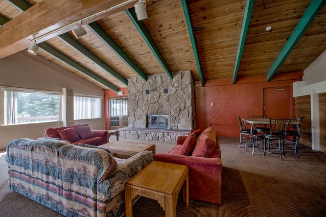 98000 Ryan Gulch Road, Unit E104 Silverthorne, CO 80498 - Photo 33 of 34 a living room with furniture and a large window