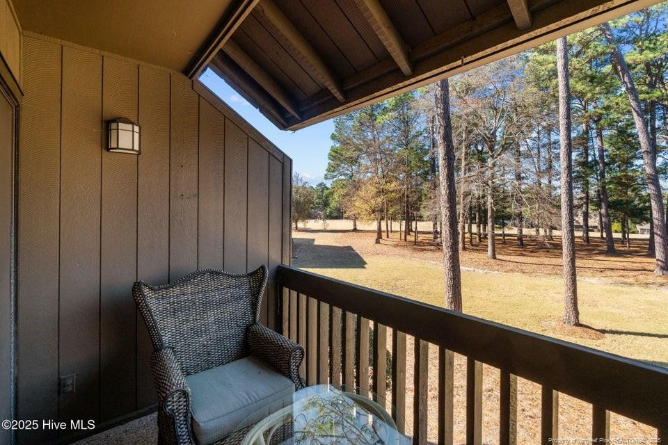 10 Pine Tree Road, Unit 211 Lakeview, NC 28350 - Photo 24 of 36 a view of two chairs in the balcony