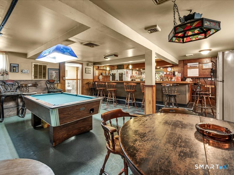 61 Maple Avenue Wallingford, CT 06492 - Photo 13 of 20 a living room with pool table and chairs