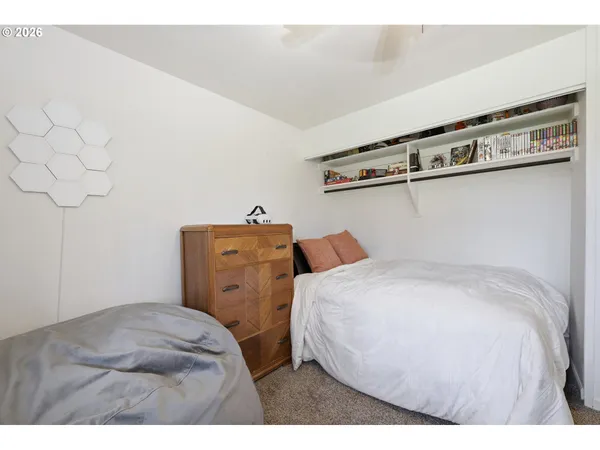 a bedroom with a bed and cabinets