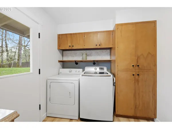 a view of storage and utility room with washer and dryer