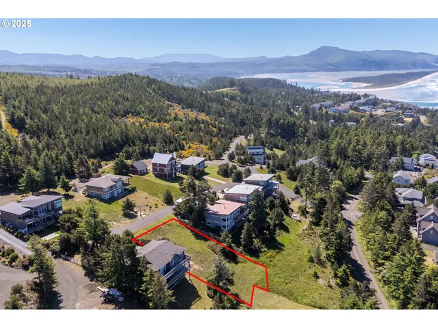 a view of a brick house with a yard