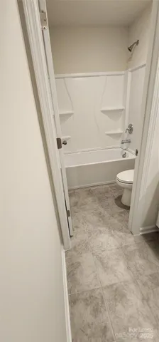 an empty room with shelves