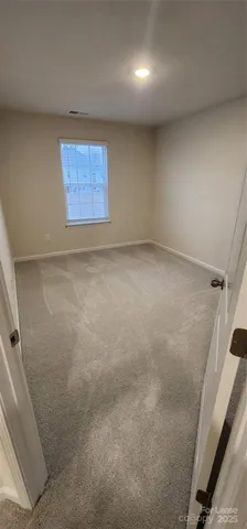a bathroom with double sink and a mirror