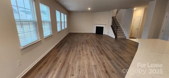 a white toilet sitting next to a white sink and vanity