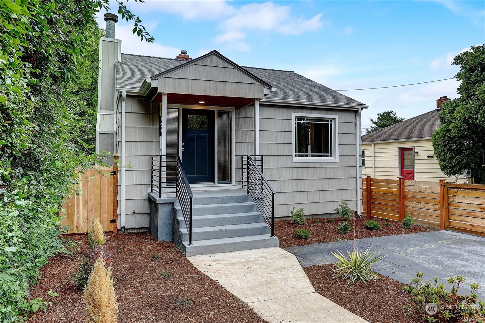 8421 16th Avenue Southwest Seattle, WA 98106 - Photo 1 of 16 a front view of a house with a yard