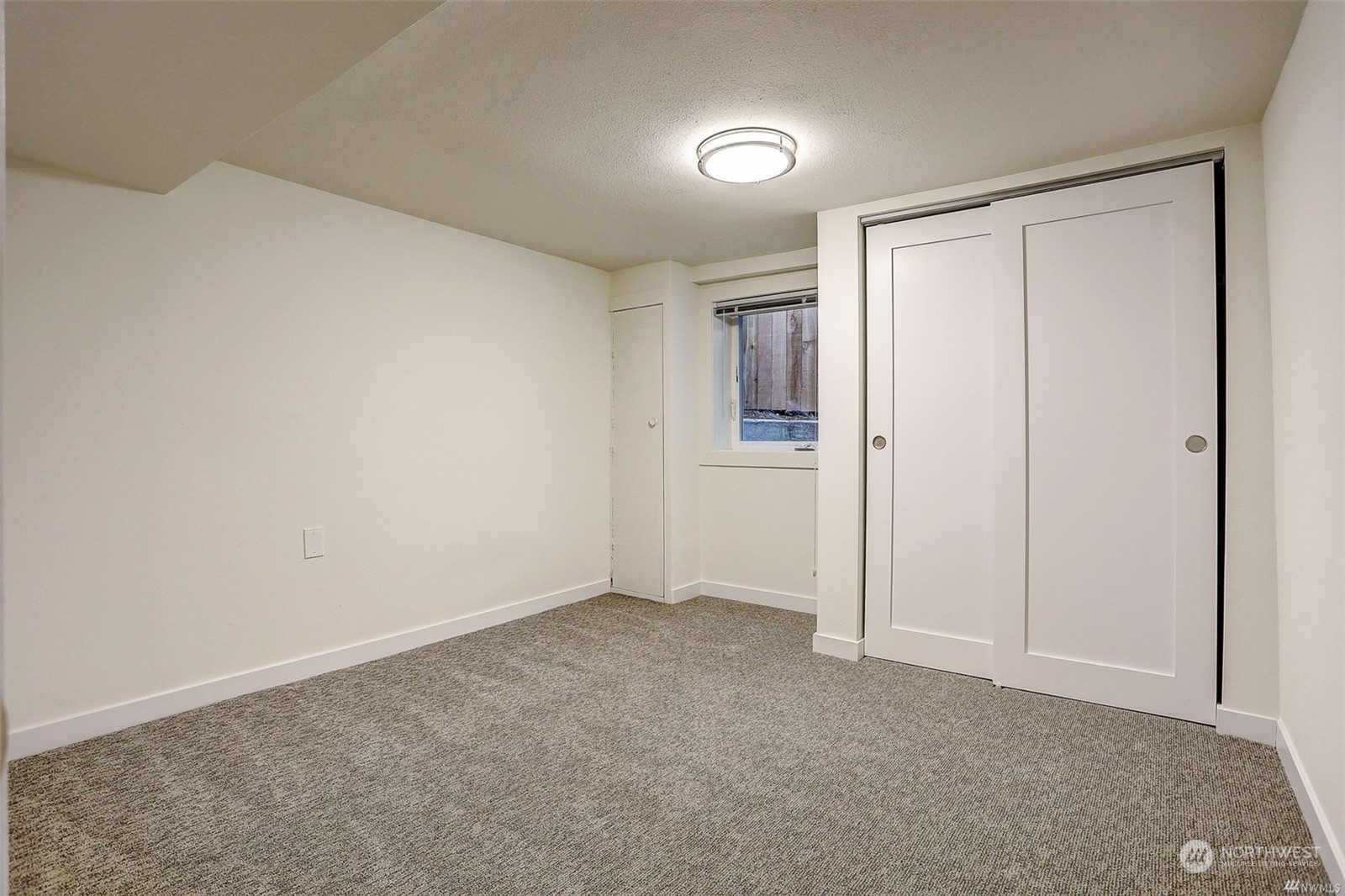 8421 16th Avenue Southwest Seattle, WA 98106 - Photo 15 of 16 a view of an empty room and closet area