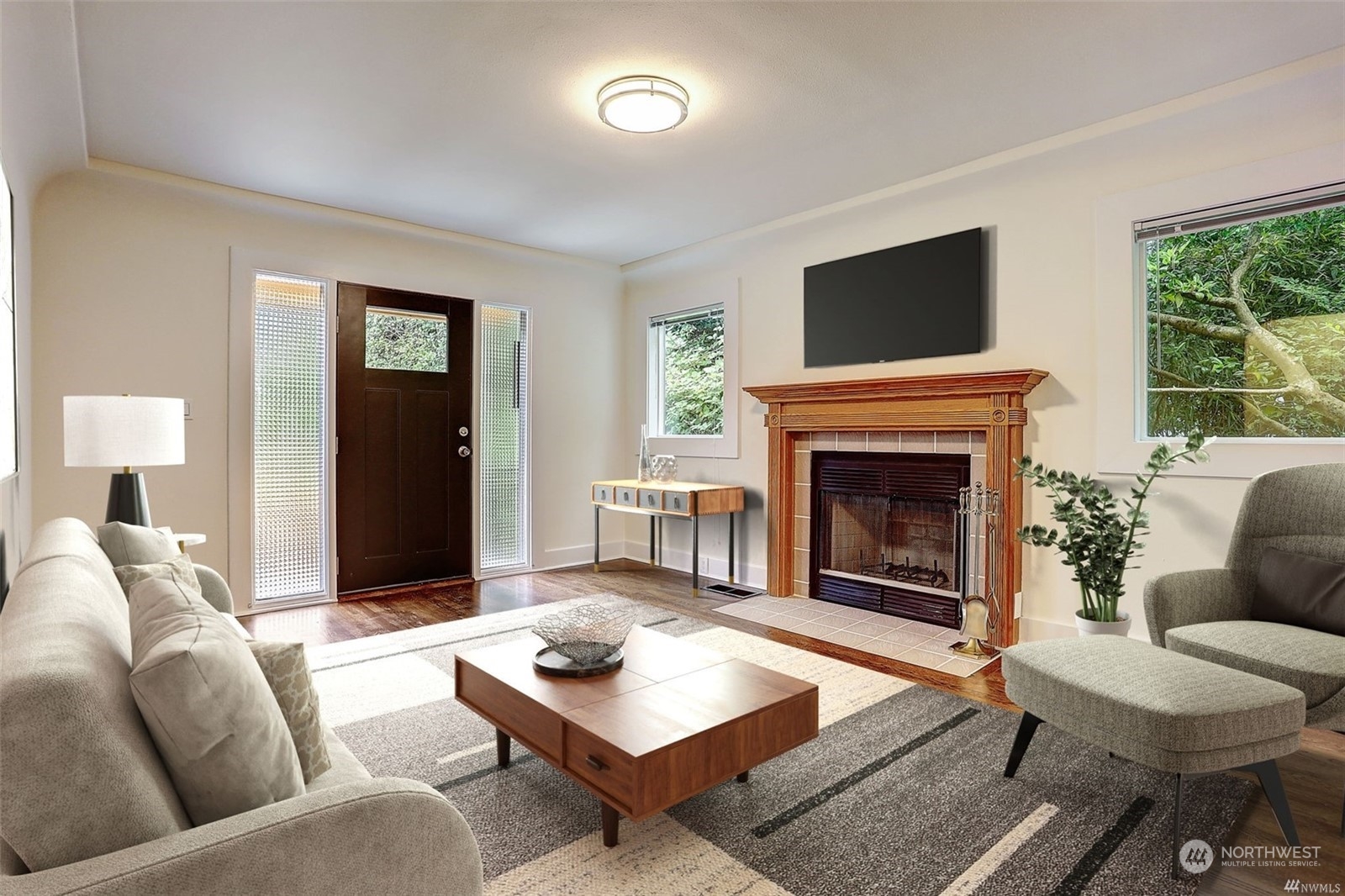 8421 16th Avenue Southwest Seattle, WA 98106 - Photo 6 of 16 a living room with furniture flat screen tv and a fireplace