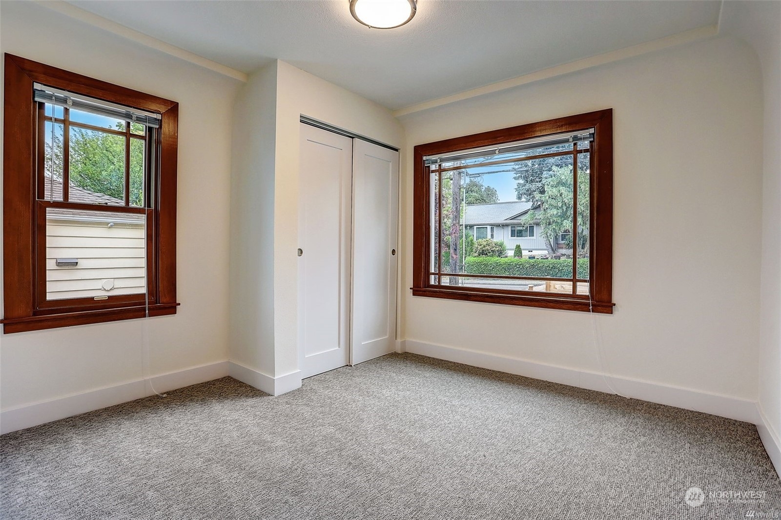 8421 16th Avenue Southwest Seattle, WA 98106 - Photo 9 of 16 an empty room with windows