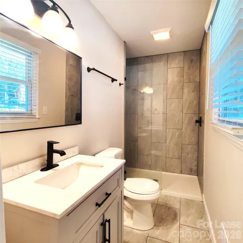 a bathroom with a bathtub and shower