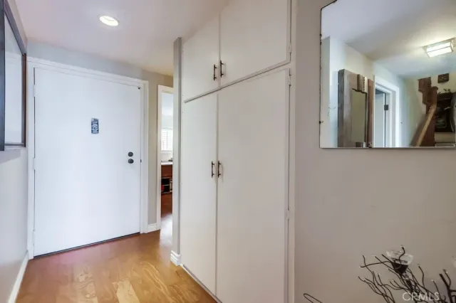 a bathroom with a toilet a sink and a mirror