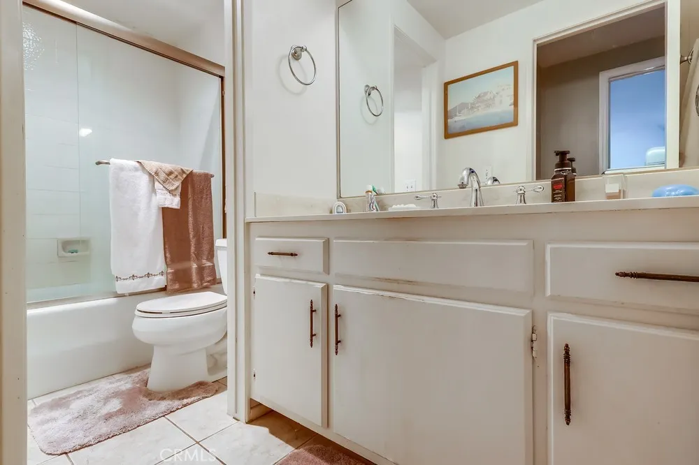 711 West 33rd Street San Pedro, CA 90731 - Photo 17 of 73 a bathroom with a toilet a sink and a mirror