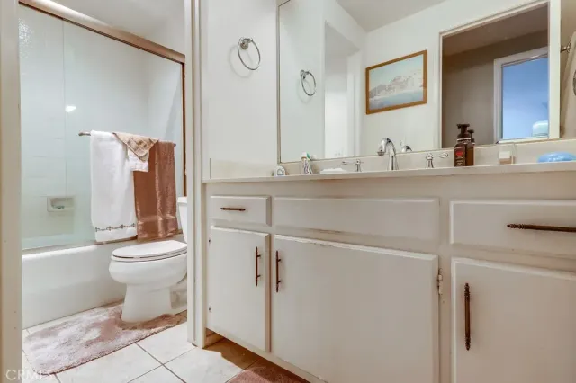 a living room with furniture and a lamp