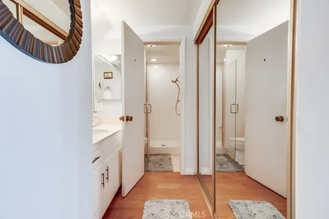 a bathroom with a sink a mirror and a toilet