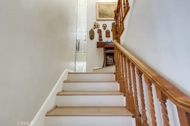 a living room with furniture and large windows