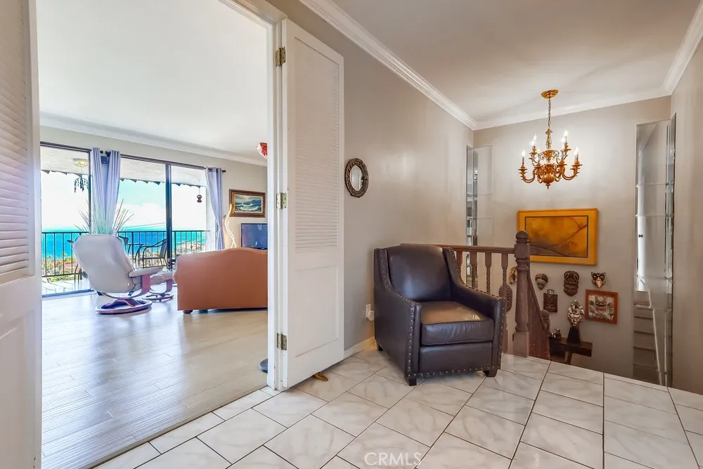 711 West 33rd Street San Pedro, CA 90731 - Photo 22 of 73 a living room with furniture and a chandelier