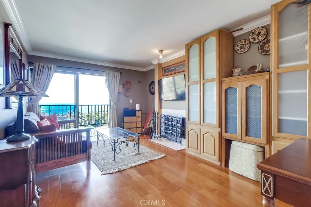 711 West 33rd Street San Pedro, CA 90731 - Photo 23 of 73 a living room with furniture large windows and wooden floor