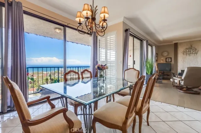 a balcony with table and chairs