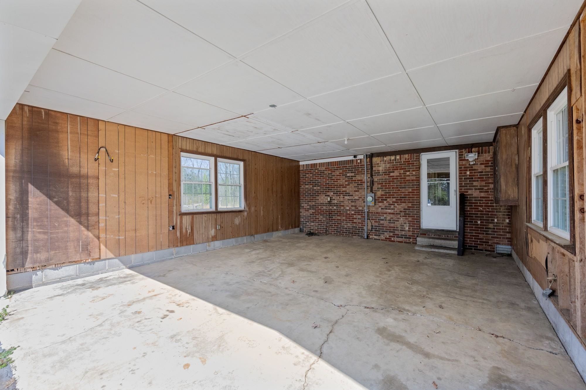 1705 100th Highway West Decaturville, TN 38329 - Photo 18 of 27 a view of a big room with windows