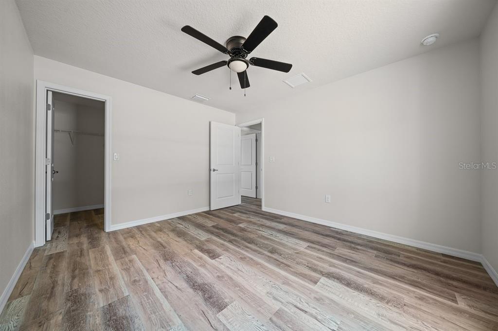 8992 North Lisa Terrace Citrus Springs, FL 34433 - Photo 20 of 25 a view of empty room with wooden floor