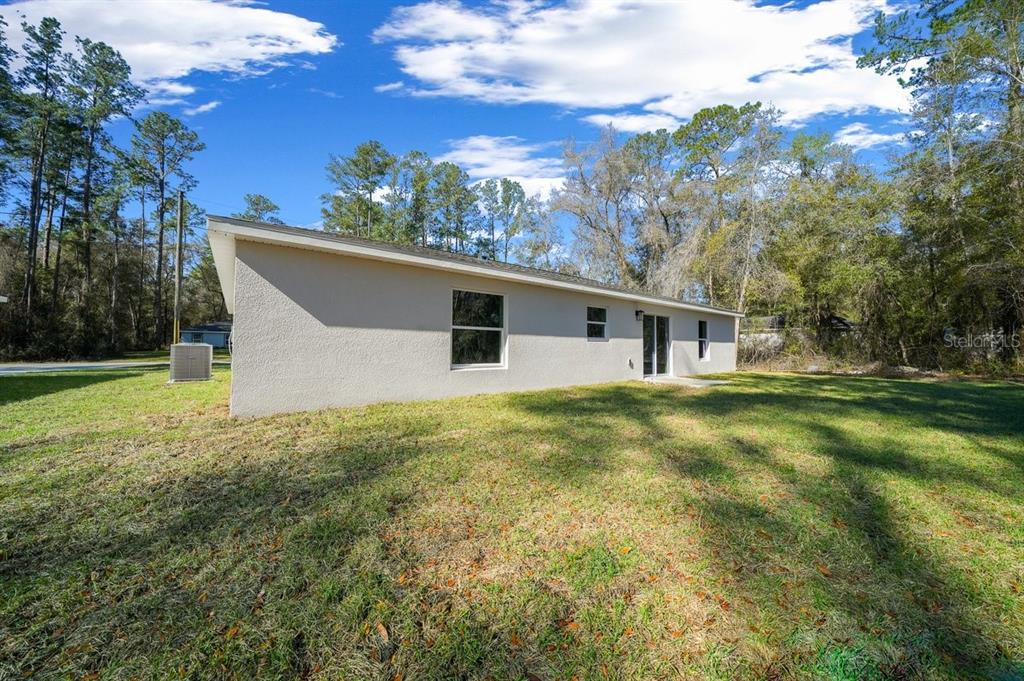 8992 North Lisa Terrace Citrus Springs, FL 34433 - Photo 23 of 25 a view of a house with a backyard