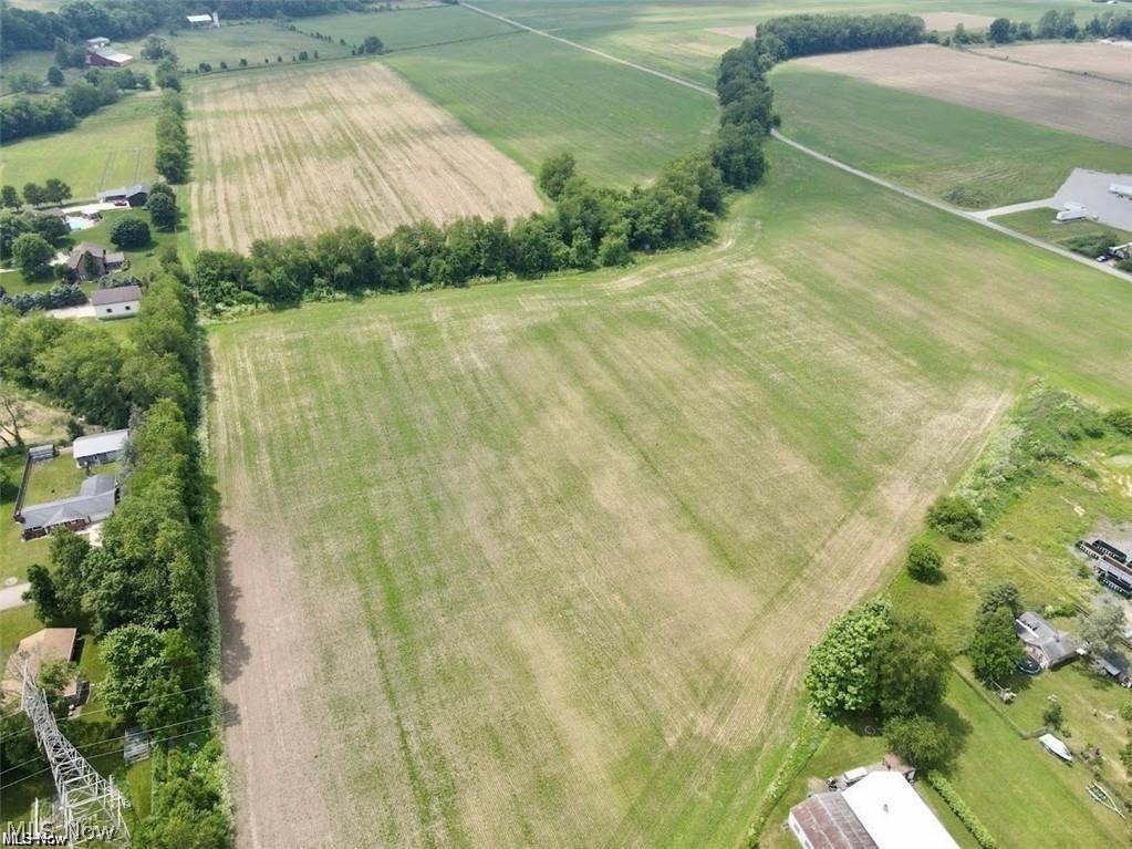 250 Northwest State Route Strasburg, OH 44680 - Photo 2 of 3 Aerial view of sparsely populated area featuring rows of crops