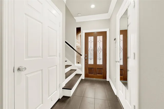 a view of entryway with furniture and wooden floor