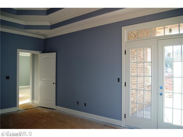 122 Idlewild Road Advance, NC 27006 - Photo 11 of 15 Master Bedroom. French doors in master bedroom lead out to wrap around porch.