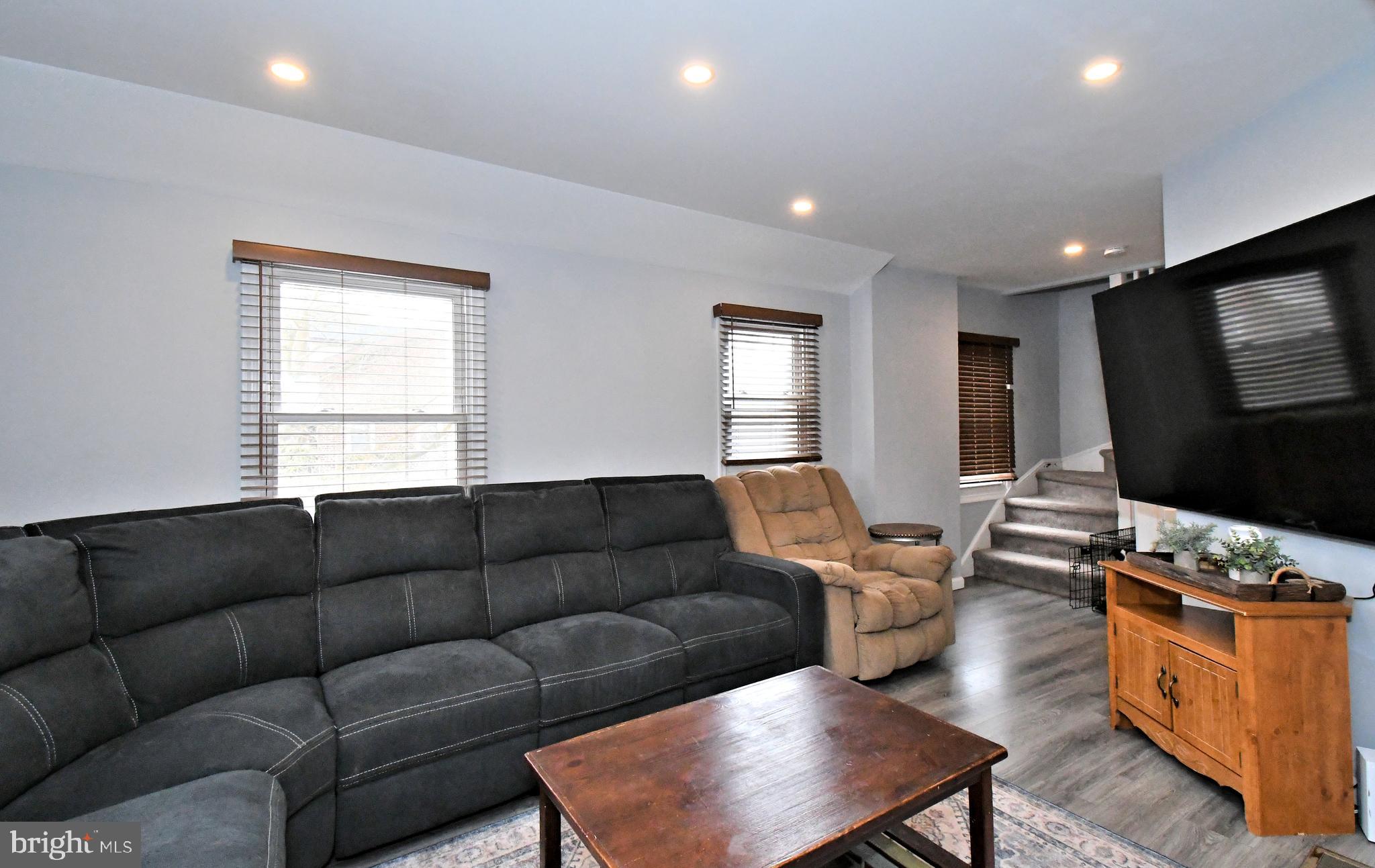 510 North Pleasantview Road Pottstown, PA 19464 - Photo 11 of 37 a living room with furniture flat screen tv and a window
