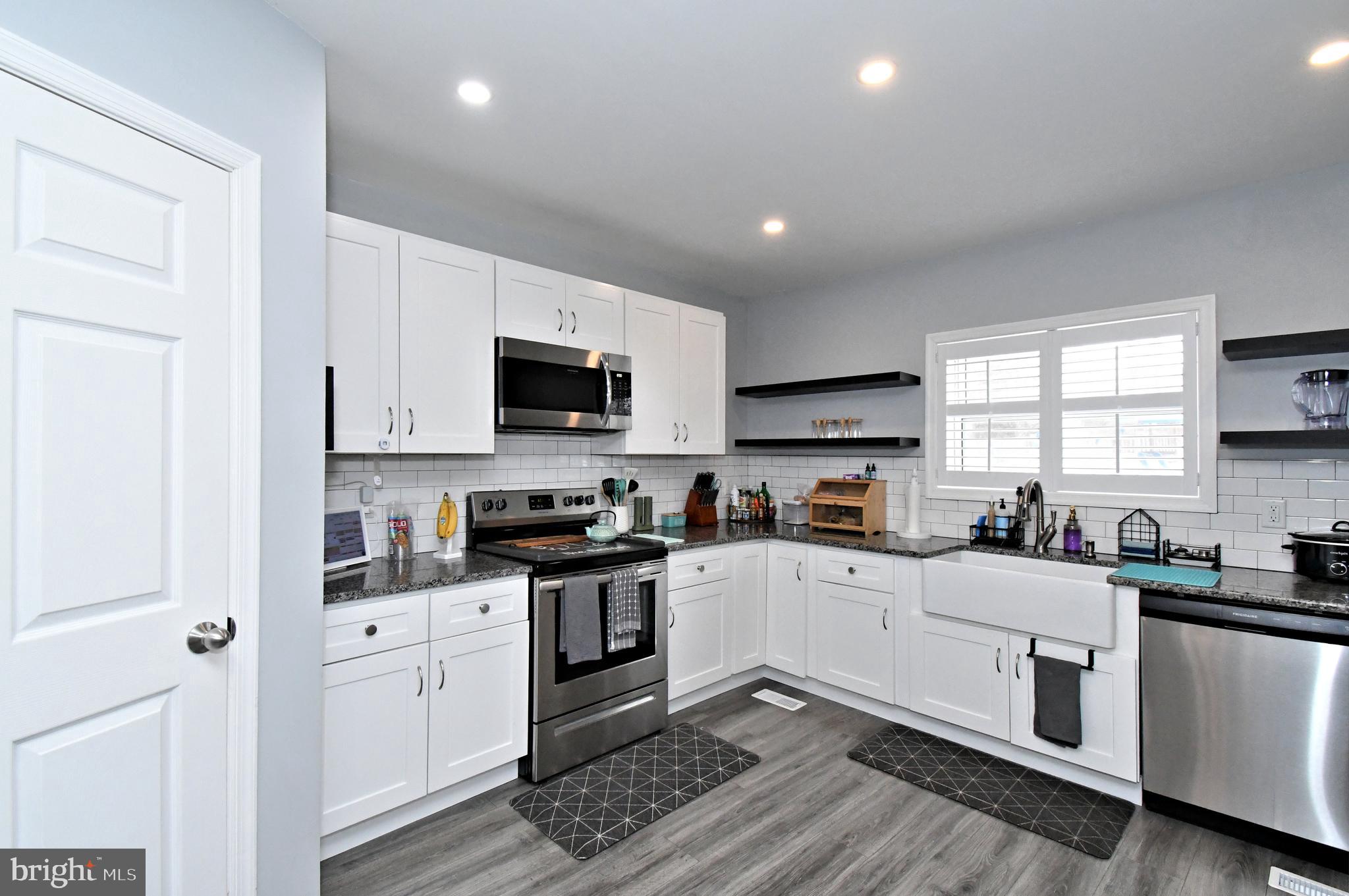 510 North Pleasantview Road Pottstown, PA 19464 - Photo 13 of 37 a kitchen with granite countertop a sink a counter space stainless steel appliances and cabinets