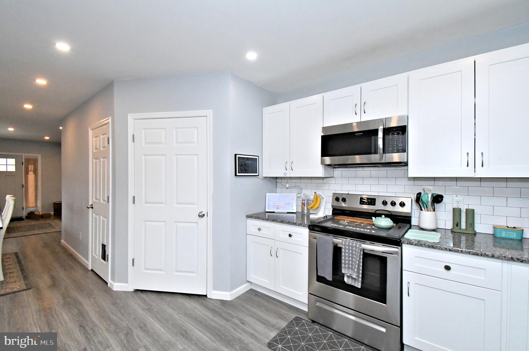 510 North Pleasantview Road Pottstown, PA 19464 - Photo 16 of 37 a kitchen with stainless steel appliances granite countertop a stove a sink and a microwave