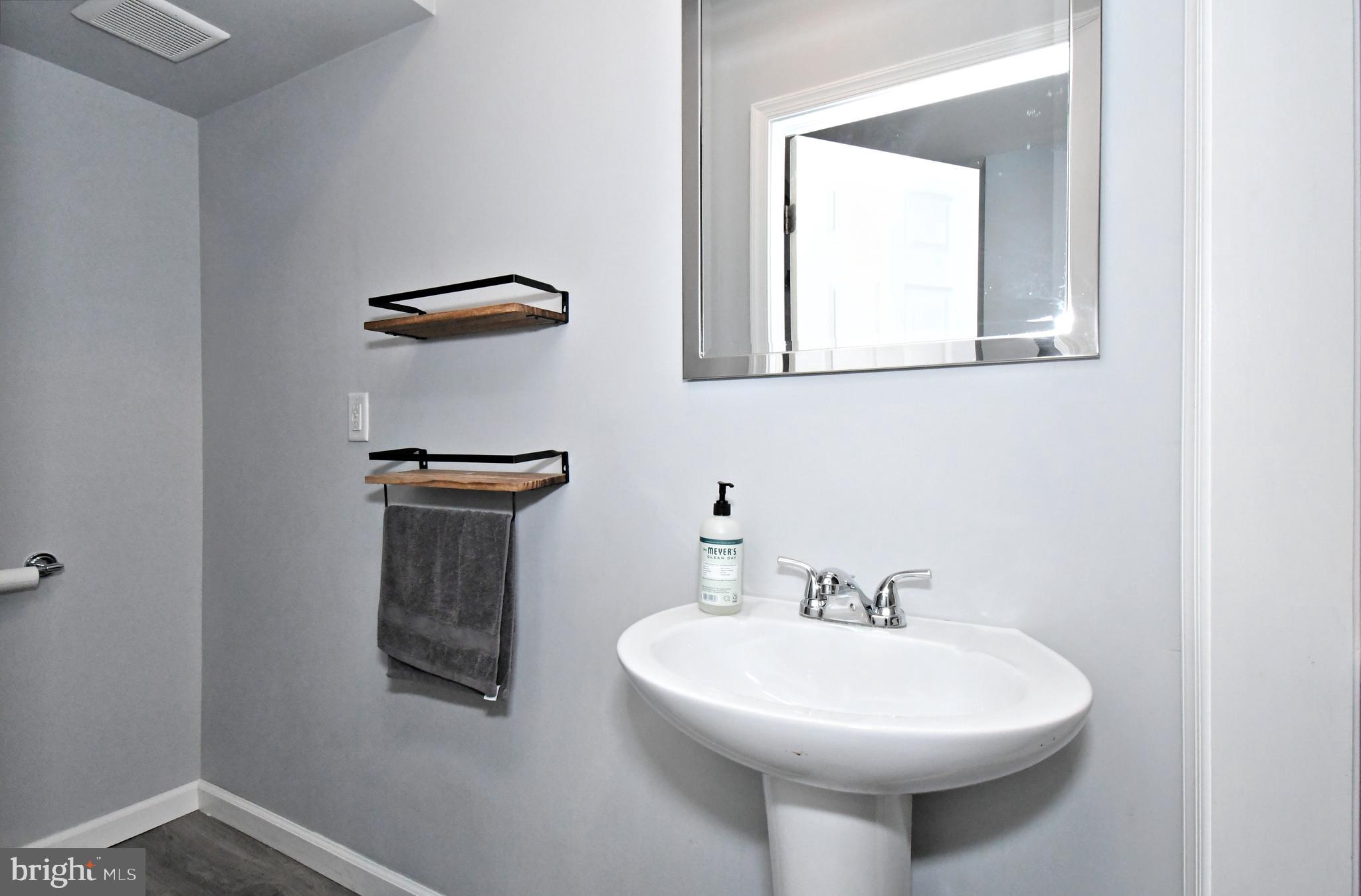 510 North Pleasantview Road Pottstown, PA 19464 - Photo 19 of 37 a bathroom with a sink a mirror and a toilet